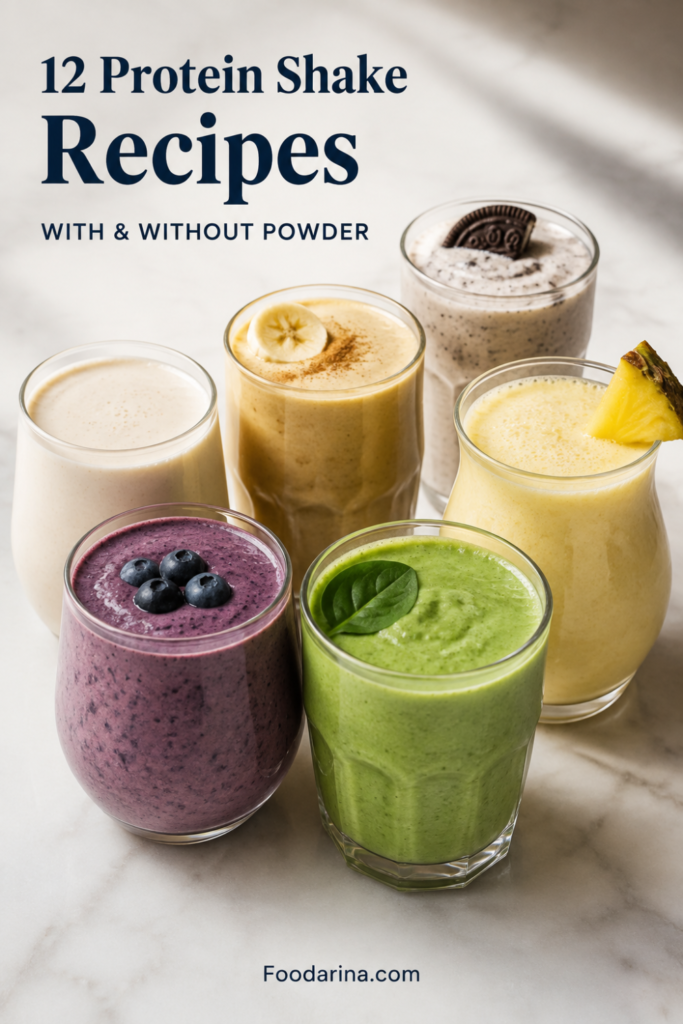 Vertical Pinterest pin showing six creamy protein shakes grouped on a bright stone surface: purple berry, green, pineapple-yellow, banana-beige, pale vanilla, and cookies-and-cream. Text reads “12 Protein Shake Recipes,” “With & Without Powder,” and “Foodarina.com.”